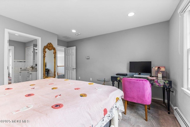 carpeted bedroom with baseboard heating and recessed lighting