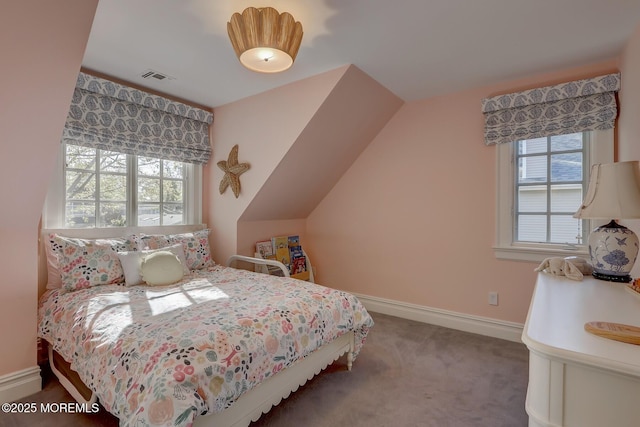 bedroom with baseboards, visible vents, multiple windows, and carpet