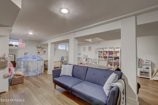 living area with recessed lighting and wood finished floors