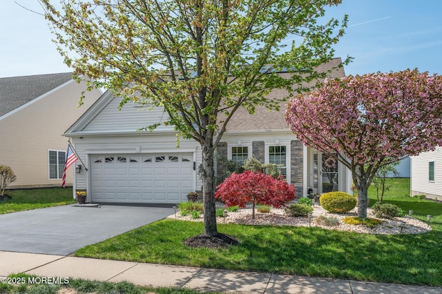 8 Ascot Ln, Manchester, NJ 08759 - view of front facade with a front lawn, driveway, stone siding, and an attached garage