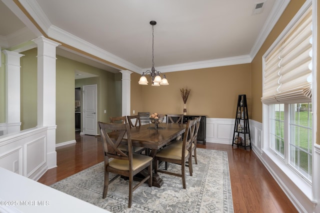 8 Ascot Ln, Manchester, NJ 08759 - dining space featuring wood finished floors, a decorative wall, decorative columns, visible vents, and crown molding