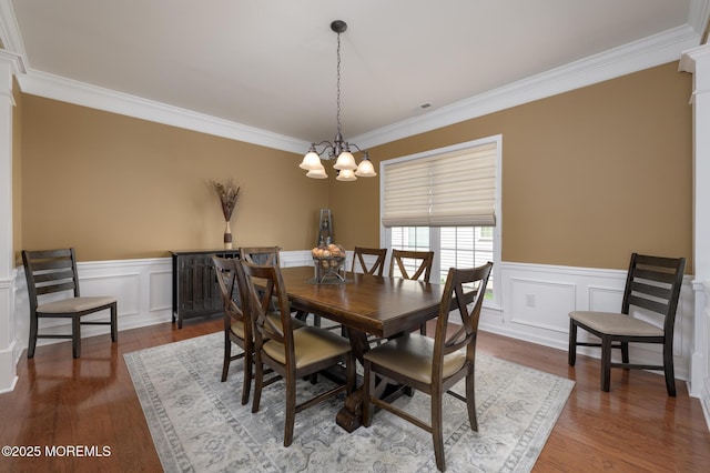 8 Ascot Ln, Manchester, NJ 08759 - dining space featuring dark wood-style flooring, a chandelier, crown molding, and a wainscoted wall