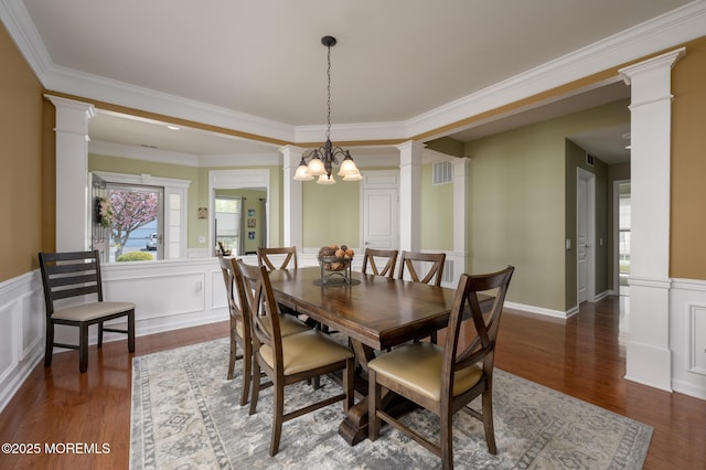 8 Ascot Ln, Manchester, NJ 08759 - dining area with crown molding, a wainscoted wall, decorative columns, and wood finished floors