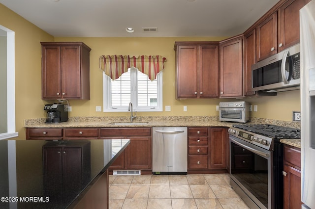 8 Ascot Ln, Manchester, NJ 08759 - kitchen with appliances with stainless steel finishes, visible vents, light stone countertops, and a sink