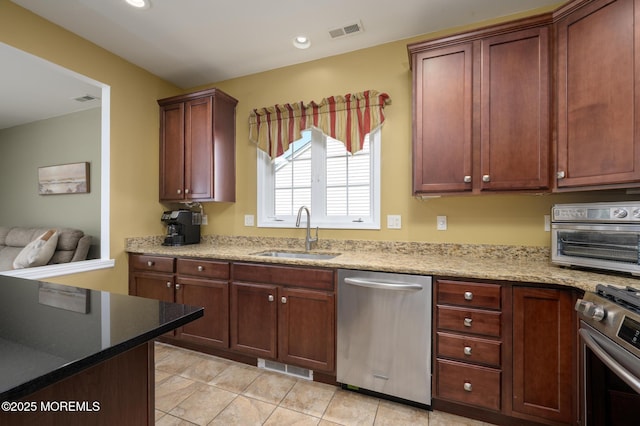 8 Ascot Ln, Manchester, NJ 08759 - kitchen with visible vents, stainless steel appliances, light tile patterned flooring, and a sink