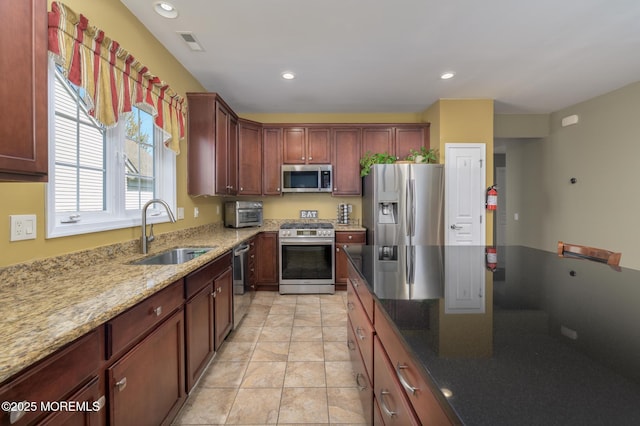 8 Ascot Ln, Manchester, NJ 08759 - kitchen with recessed lighting, light stone countertops, appliances with stainless steel finishes, a sink, and visible vents