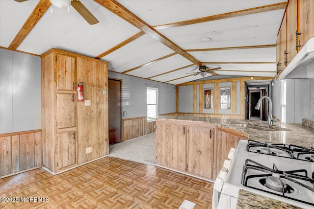 19 Mary Ann Ct, Hazlet, NJ 07734 - kitchen with ceiling fan, wooden walls, vaulted ceiling with beams, a wainscoted wall, and a sink