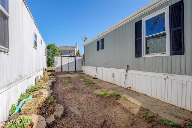 19 Mary Ann Ct, Hazlet, NJ 07734 - view of property exterior featuring a storage shed and an outdoor structure