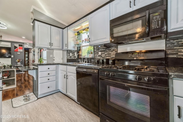 501 Ln F, Hazlet, NJ 07730 - kitchen with a sink, light wood finished floors, white cabinetry, decorative backsplash, and black appliances