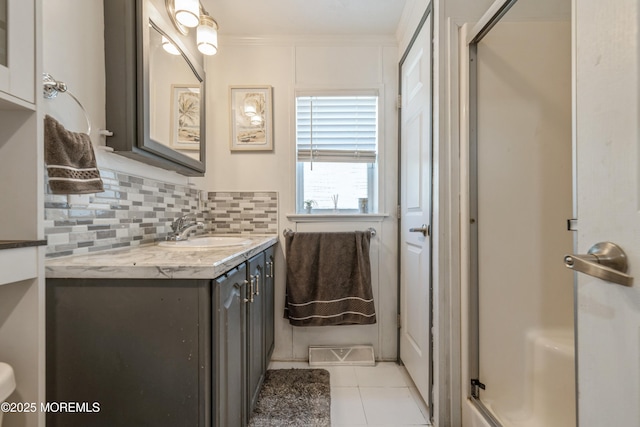 501 Ln F, Hazlet, NJ 07730 - bathroom with vanity, tasteful backsplash, a stall shower, and tile patterned floors