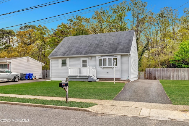 957 Harrison Rd, Toms River, NJ 08753 - new england style home featuring roof with shingles and asphalt driveway