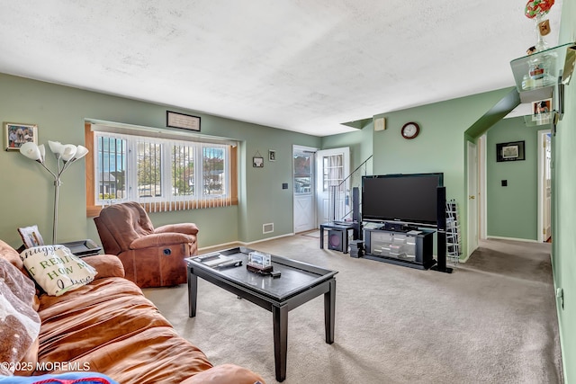 957 Harrison Rd, Toms River, NJ 08753 - carpeted living room featuring healthy amount of natural light, baseboards, and a textured ceiling