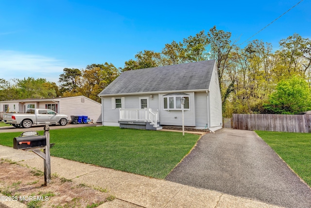 957 Harrison Rd, Toms River, NJ 08753 - view of front of house with a shingled roof, a deck, and asphalt driveway