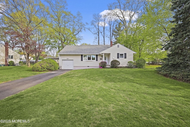 12 Mayfair Rd, Holmdel, NJ 07733 - view of front of house with a chimney, a front lawn, driveway, and an attached garage