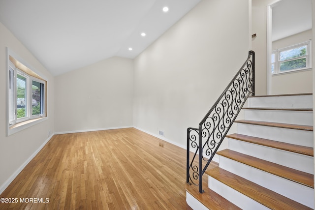 12 Mayfair Rd, Holmdel, NJ 07733 - stairway featuring recessed lighting, hardwood / wood-style floors, lofted ceiling, and baseboards