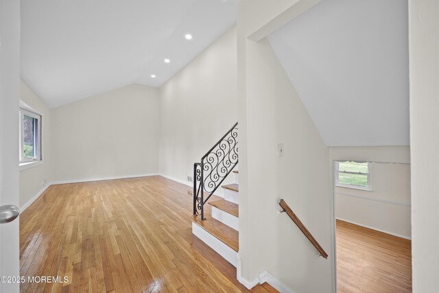 12 Mayfair Rd, Holmdel, NJ 07733 - staircase featuring lofted ceiling, hardwood / wood-style flooring, recessed lighting, and baseboards