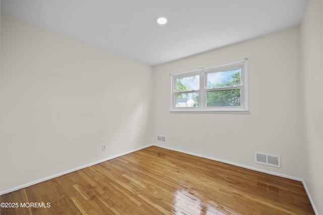 12 Mayfair Rd, Holmdel, NJ 07733 - empty room featuring visible vents, light wood-style flooring, and baseboards