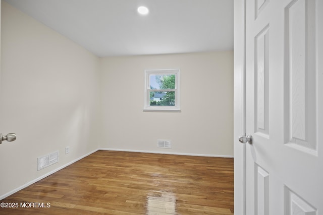 12 Mayfair Rd, Holmdel, NJ 07733 - unfurnished room with baseboards, visible vents, and wood finished floors