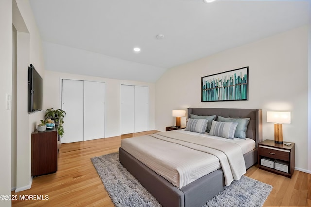 12 Mayfair Rd, Holmdel, NJ 07733 - bedroom featuring light wood-type flooring, recessed lighting, multiple closets, and vaulted ceiling