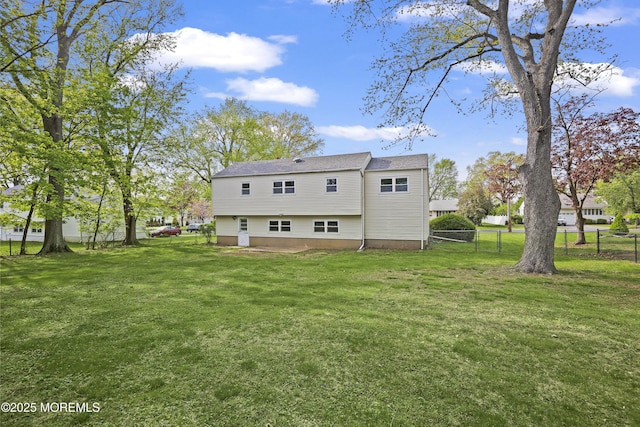 12 Mayfair Rd, Holmdel, NJ 07733 - back of house featuring a lawn, a patio, and fence
