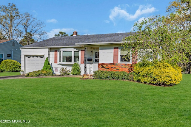 single story home featuring a front yard, a chimney, brick siding, an attached garage, and driveway