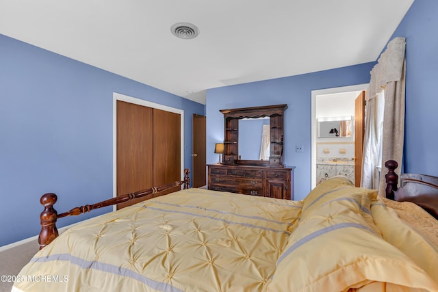 carpeted bedroom with a closet