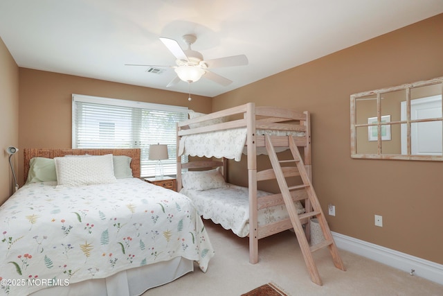 bedroom featuring a ceiling fan, baseboards, visible vents, and carpet