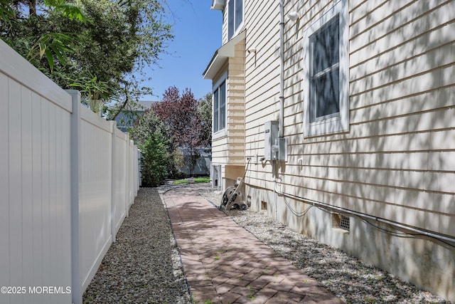 view of side of property with fence