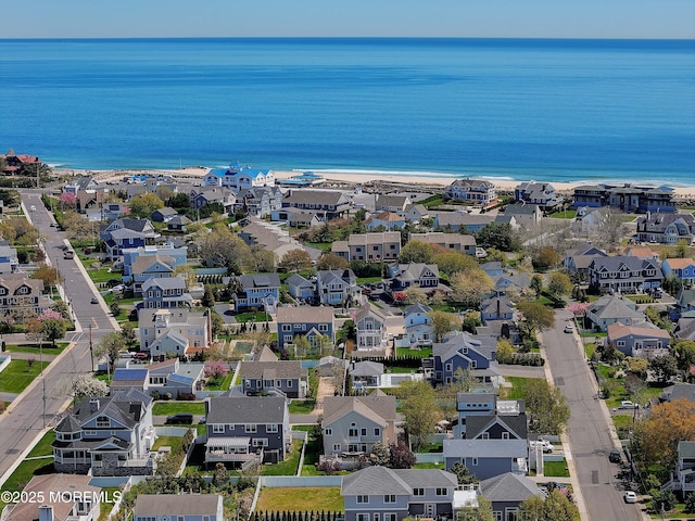 birds eye view of property featuring a residential view and a water view