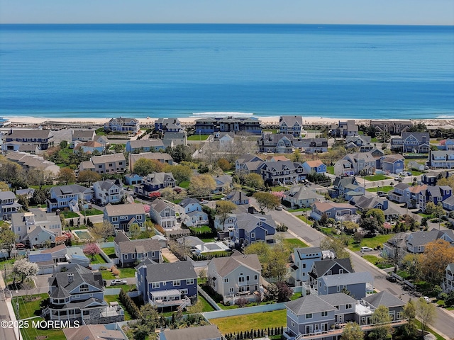 bird's eye view featuring a water view and a residential view