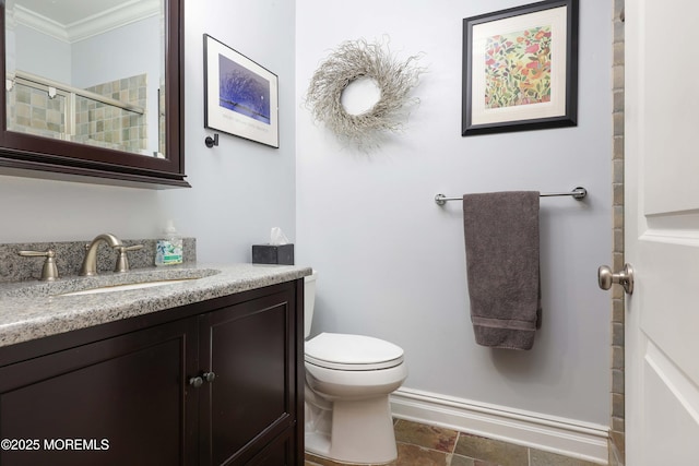 full bathroom featuring toilet, ornamental molding, a shower, and vanity