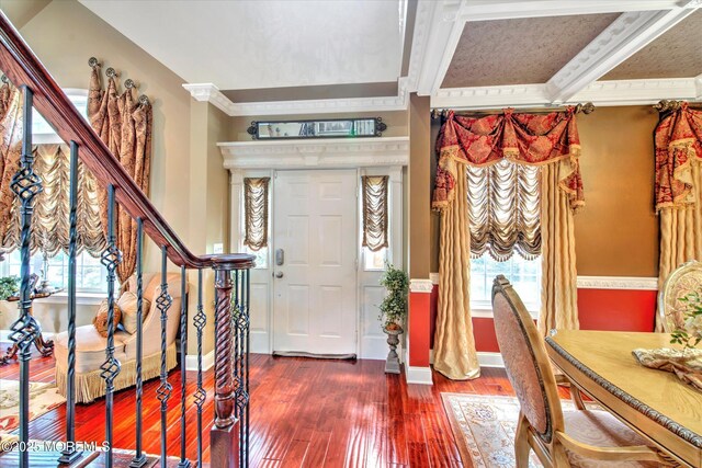 foyer entrance with stairway, baseboards, plenty of natural light, and hardwood / wood-style floors