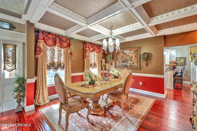 dining area featuring baseboards, a notable chandelier, and hardwood / wood-style floors