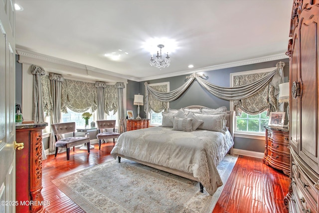 bedroom featuring an inviting chandelier, ornamental molding, baseboards, and dark wood-type flooring
