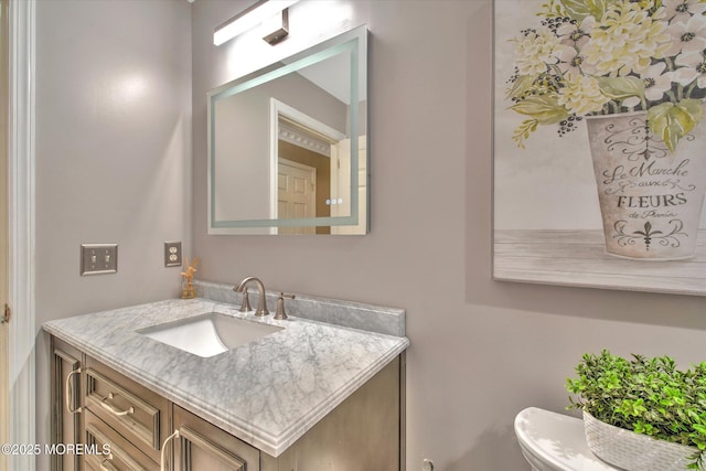half bathroom featuring vanity