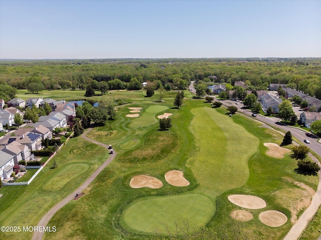 drone / aerial view with a residential view and golf course view