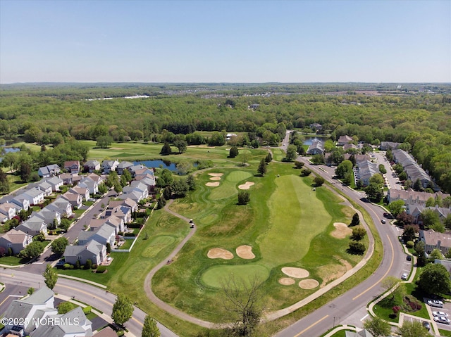 bird's eye view featuring a water view, golf course view, a residential view, and a forest view