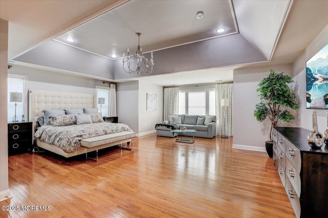 bedroom with light wood-style floors, baseboards, recessed lighting, and a chandelier