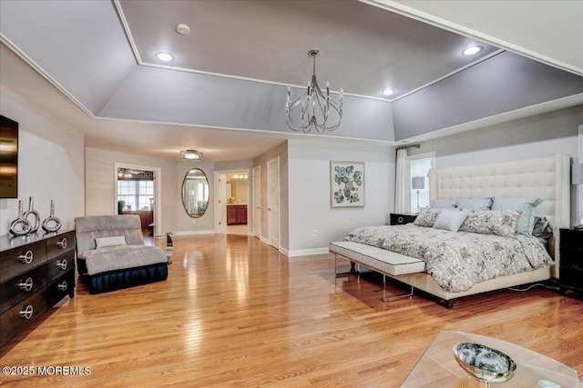 bedroom featuring an inviting chandelier, baseboards, lofted ceiling, and wood finished floors
