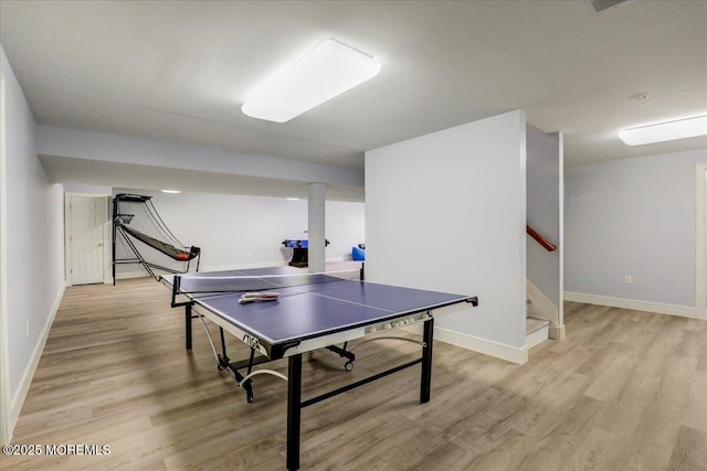 rec room featuring baseboards and light wood-type flooring