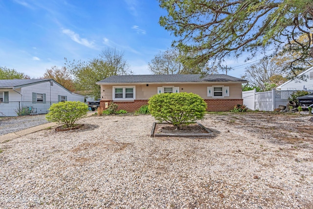 back of property with brick siding and fence