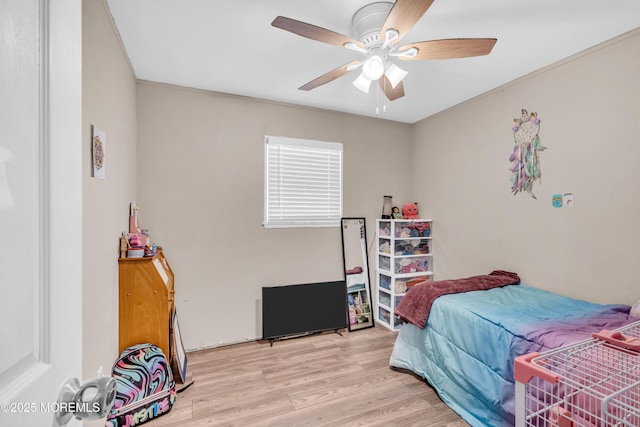 bedroom with wood finished floors and ceiling fan