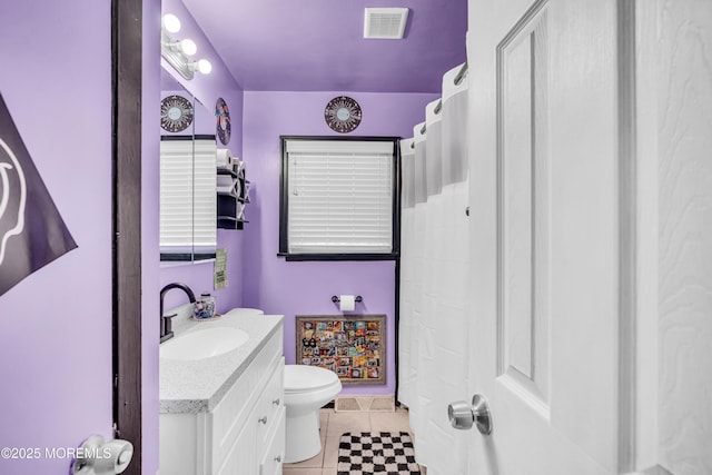 full bath with vanity, curtained shower, tile patterned floors, toilet, and visible vents
