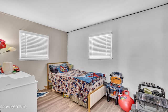 bedroom featuring light wood-style flooring