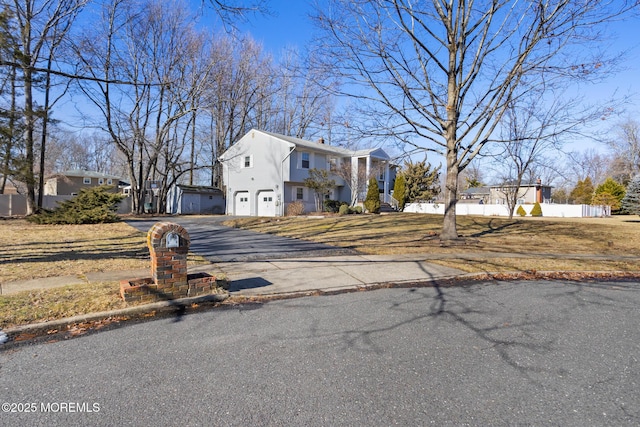 52 Yorke Ct, Freehold, NJ 07728 - colonial inspired home with a residential view, fence, an attached garage, and aphalt driveway