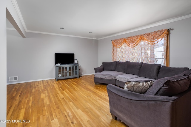 52 Yorke Ct, Freehold, NJ 07728 - living area with visible vents, light wood-style flooring, crown molding, and baseboards
