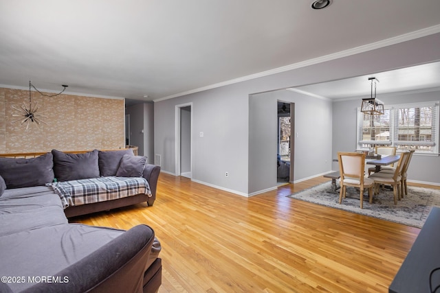 52 Yorke Ct, Freehold, NJ 07728 - living area featuring baseboards, visible vents, ornamental molding, and light wood-style flooring