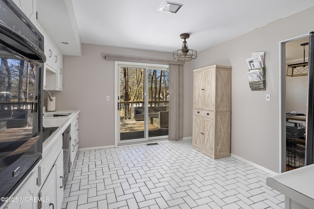 52 Yorke Ct, Freehold, NJ 07728 - interior space featuring baseboards, brick patterned floor, and visible vents