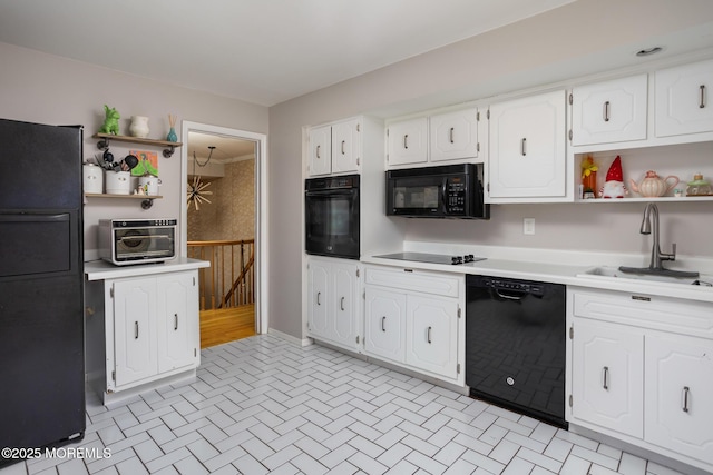 52 Yorke Ct, Freehold, NJ 07728 - kitchen with light countertops, open shelves, a sink, and black appliances