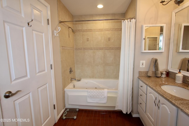 bathroom featuring shower / bath combo with shower curtain, recessed lighting, and vanity